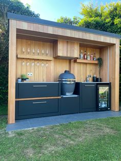 an outdoor bar is built into the side of a building with wooden paneling and shelves