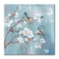 two birds perched on branches with white flowers