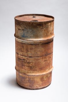 an old wooden barrel sitting on top of a table