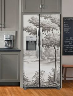 an image of a kitchen setting with refrigerator and coffee maker on the counter top in front of it