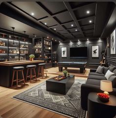 a living room filled with lots of furniture and a pool table in front of a bar