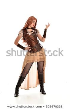 a woman dressed in an old fashioned costume posing for the camera with her hands out