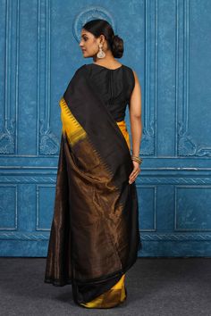 Look your best on festive occasions in this beautiful yellow and black Gadhwal silk saree. It comes with a matching blouse piece. Disclaimer: The shown stitched blouse on the model is for display purpose only. The saree comes with a matching blouse piece and finished with fall and piko. Tussar Silk Sarees, Indian Clothing Store, Fashion Journals, Tussar Silk Saree, Indian Clothing, Traditional Fabric, Silk Sarees Online, Saree Online, Yellow And Black