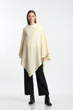 Versatile and elegant knitted poncho, made with fine baby alpaca fiber, enhances your style with a touch of elegance and modernity for any occasion, it is perfect for a fall winter season, soft, warm and cozy We develop our garments from design, through different production processes to the finished garment. Our collection of products is inspired and developed using the best materials such as fine alpaca fiber, using modern textile machinery that helps us to have better finishes with excellent quality. Measures: Weight: 380 grams Gender: unisex Color: Cream Country: Manufacturing Peru WASHING INSTRUCTION -Dry clean -Warm iron -Do not use solvents -Do not machine wash -Country: Manufacturing Peru ALPACA FIBER - Alpaca fiber is one of the finest animal fibers in the world. Peru accounts for Elegant One-size Cashmere Poncho, Elegant One-size Cape Poncho, Elegant One Size Cape Poncho, Elegant Solid Poncho For Fall, Elegant Oversized Poncho Cape, Elegant Oversized Cape Poncho, Elegant Beige Cape Poncho, Elegant Beige One Size Poncho, Elegant One Size Beige Poncho