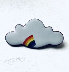 Berty & Gerty Vintage present this ceramic cloud and rainbow brooch. Comes gift wrapped. Features a secure pin back. White Retro Brooch For Gift, White Retro Style Brooch For Gift, White Retro Brooches As Gift, Retro White Brooches As Gift, Novelty White Pins For Gifts, Rainbow Brooch, Cloud And Rainbow, Porcelain Brooch, Cloud Rainbow