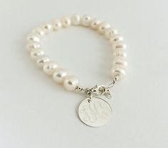 Monogram Freshwater Pearl Bracelet with Sterling by netexchange Elegant Silver Name Bracelet With Round Beads, Classic Personalized Pearl Bracelet, Personalized Classic Pearl Bracelet, Classic Personalized White Pearl Bracelet, Elegant Personalized Round Bead Pearl Bracelet, Personalized Round Bead Pearl Bracelet In Elegant Style, Personalized Elegant Pearl Bracelet, Elegant Personalized Pearl Bracelet, Personalized Round Bead Pearl Bracelet