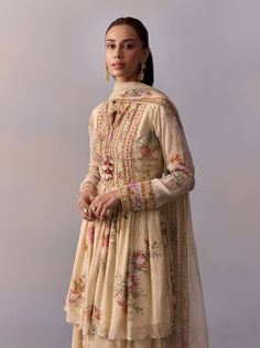 Turn heads with this chic short kurta and voluminous sharara set, paired with a breezy dupatta for effortless elegance. The exquisite katdana embroidery on the yoke elevates its charm, making it the ideal choice for festive celebrations or weddings to create a standout style statement. Indian Western Dress, Off White Anarkali, Mens Indian Wear, White Anarkali, White Kurta, Traditional Indian Outfits, Blossom Print, Sharara Set, Indian Clothing