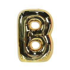 the letter b is made out of gold foil and has two small holes in it