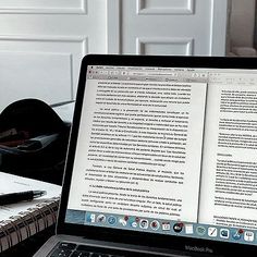 an open laptop computer sitting on top of a desk