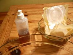 a wooden table topped with a glass bowl filled with butter