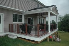 a house with a deck and covered patio