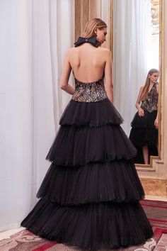 Description Black High-low, Long dress Sleeveless Halter neck Tulle, Printed fabric Dry Clean Made in Lebanon SKU ga-5621-ga-5622 High Low Gown, Skirt Tulle, Halter Gown, Tulle Gown, A Line Gown, Tier Skirt, Puff Sleeve Top, Sequin Top, Halter Neckline