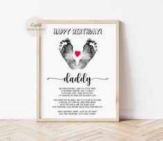 a happy birthday card with two hands and a heart in the middle, on a wooden frame