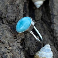 Dominican Larimar Gemstone Ring- Bezel Setting Statement Ring- 925 Sterling Silver Ring- Larimar Gemstone Gift Ring- Oval Cab Larimar Ring Larimar is not only a rare and beautiful stone reminiscent of the clear blue waters that surround the area that it comes from in the Caribbean, but it is said to be a stone that promotes feelings of serenity and works on the throat chakra, opening the doors of communication helping us to speak from the heart while aiding emotional strength and stability. Size Stone Ring Women, Chakra Opening, Oval Stone Ring, Larimar Ring, Emotional Strength, Larimar Rings, Bezel Set Ring, Ring Bezel, Artisan Rings