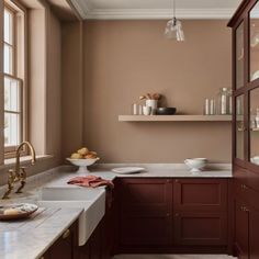 a kitchen with brown cabinets and white counter tops