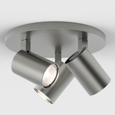 two spotlights are attached to the ceiling in this modern style light fixture, which is made from stainless steel