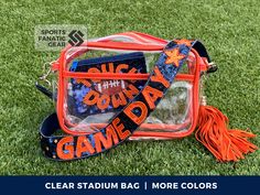 A customizable clear stadium bag to look chic and trendy while showing your team spirit!  These cute bags are perfect for game days and are also a unique gift for the sports fans in your life! *This listing is for bag with matching canvas strap and tassel only (with optional sequin strap add on), all other items pictured are sold separately* You get: - Matching canvas strap and tassel - Option to add on a sequin strap - See listing photos for color details Purse details: - Approx. 9.8" W x 5.12" Game Day Accessories, Clear Stadium Bags Diy, Clear Purses For Football Games, Game Day Clear Bag, Cute Clear Stadium Bags, Football Bags, Beaded Gameday Purse Strap, Clear Stadium Crossbody Bag, Football Bag