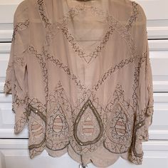 Beaded Chiffon Throw With Dolman Sleeves Size Small But It’s A Loose Fit Great For Turn Blue Jeans Or Over A Dress , Never Wore It , Brand New Condition ! Not A Bead Out Of Place Bohemian Chiffon Blouse For Party, Elegant Embellished Summer Blouse, Beaded Long Sleeve Summer Blouse, Bohemian Embellished Tops For Wedding, Bohemian Long Sleeve Blouse With Sequins, Beige Bohemian Blouse For Party, Bohemian Beige Blouse For Party, Beige Bohemian Party Blouse, Summer Embellished Beige Blouse