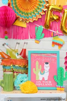 a birthday party with balloons, tassels and decorations