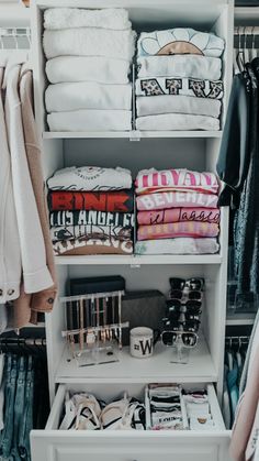 an organized closet with clothes and other items