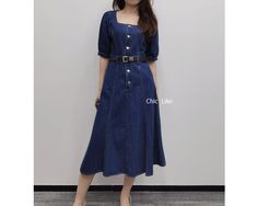 Item No. SZ117 Material: Cotton Color: Blue US Size: S, M, L, XL, 1XL - Handcrafted. - Denim Dress. - Midi Length. - Pockets. - Belted. - A Line. - Sleeves. - Square Collar. - High Waist. - Button Front. - Made ethically with a lot of love and care. Casual Medium Wash Denim Dress With Square Neck, Casual Blue Denim Dress With Square Neck, Casual Denim Dresses With Square Neck, Midi Dress With Pockets, Denim Midi Dress, Dress With Sleeves, Dress Denim, Belted Midi Dress, Stylish Dress Designs