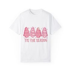 Get into the festive spirit with this Tis the Season Pink Christmas Trees Graphic T-Shirt. This holiday tee is perfect for women looking for a cute and festive winter shirt. It's a great Christmas gift idea that exudes a cheerful and fun vibe. Ideal for holiday gatherings, Christmas parties, and seasonal celebrations. Product features - Available in S to 4XL sizes for the perfect fit - Double-needle stitching for durability - Without side seams for a more attractive look - Garment-dyed fabric fo Pink Christmas Trees, Christmas Tree Cakes, Casual Holiday Outfits, Christmas Coquette, Christmas Tree Graphic, Christmas Tree Cake, Tree Cakes, Winter Shirts, Pink Christmas Tree