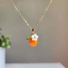 Can't find your perfect fit length? Do have material requirements? We offer custom orange fruit necklace. Your satisfaction is our priority. How to customize? You choose the design; we hand make the necklace for you. Elevate your style with this exquisite orange flower pendant necklace. The pendant is delicately crafted with intricate details, capturing the beauty of nature in its design. You offer various colors of orange. Lightweight and comfortable to wear, it's the perfect accessory to compl Coworker Appreciation, Acrylic Leaves, Flowers Acrylic, Rain Design, Fruit Necklace, Anniversary Necklace, Orange Necklace, Orange Fruit, Flower Pendant Necklace