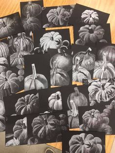 black and white pictures of pumpkins on a table with paper cut out to look like them