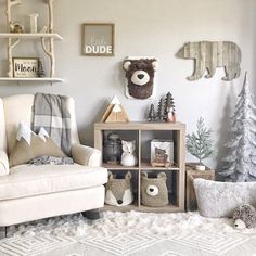 a living room filled with furniture and christmas decorations on the wall next to a teddy bear