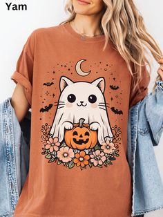 👻🐱This Cute Ghost Cat T-shirt is perfect for cat lovers who enjoy a playful and adorable design. The garment-dyed fabric offers a soft color and texture, making it comfortable to wear. It's ideal for casual outings or lounging at home, and it makes a great gift for Halloween or cat-themed celebrations. 🌟Product features - Available in sizes S to 4XL for the perfect fit - Double-needle stitching for durability - Knit in one piece without side seams for a sleek look - Made with high quality, 100% ring-spun US cotton for comfort - Relaxed fit and crew neckline for versatile styling 🌟Care instructions - Machine wash: cold (max 30C or 90F) - Do not bleach - Tumble dry: low heat - Iron, steam or dry: low heat - Do not dryclean 🌟PRODUCTION TIME: Each item is custom-made for your order. Pleas Spooky Cat Print Crew Neck T-shirt, Spooky Cat Design T-shirt For Fall, Spooky Cotton Tops With Cat Design, Spooky Cotton Top With Cat Design, Fall Cat Design Short Sleeve T-shirt, Fall Season Cat Design Short Sleeve T-shirt, Fall Short Sleeve T-shirt With Cat Design, Spooky Cotton T-shirt With Cat Print, Fall Cotton T-shirt With Cat Design