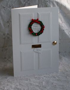 a white door with a wreath on it