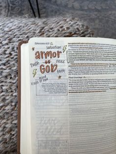 an open bible with the words salvation and armor of god written on it