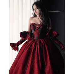 This Gothic Black And Red Wedding Dress With Gloves is sure to make a statement on your special day. Featuring a classic Burgundy Ball Gown silhouette, this dress is crafted from fine, luxurious fabrics and adorned with intricate embroidery. The sweeping skirt is adorned with delicate lace embroidery, while the bodice is tailored with a corset-style top and adjustable ribbon straps. The long, elegant gloves of this dress add a touch of sophistication, while the deep red and black colors lend a d Black And Red Wedding Dress, Wine Wedding Dresses, Red Wine Wedding, Wedding Dress With Gloves, Wedding Dresses Ball Gown Sweetheart, Burgundy Ball Gown, Black And Red Wedding, Red Ball Gown, Dress With Gloves