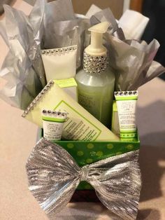 a gift basket with soap, lotion, and hand sanitizers in it