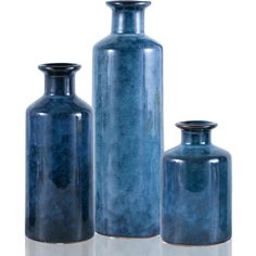 three blue vases sitting next to each other