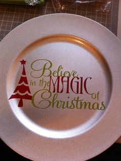 a plate with the words believe in the magic of christmas on it