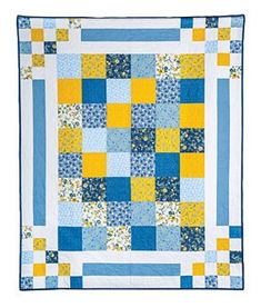 a blue and yellow quilt on a white background