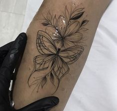 a woman's leg with a tattoo on it and a flower in the center