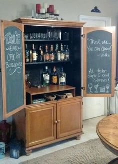 a wooden cabinet with chalkboard on it