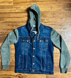 Vertical + Eagle * Blue/Gray * Distressed * Denim * Medium * Jacket W/ Hood. This jacket is in MINT condition with NO tears or stains on the fabric!! This jacket appears to have never been used.  Details: 1.) Chest: 42"'inches  2.) Waist: 42" inches  3.) Hip: 42" inches  4.) Shoulder to shoulder: 19"inches  5.) Sleeve Length: 35" inches  6.) Shoulder to hem: 35"'inches  7.) 98% Cotton; 2% Lycra  8.) 6 buttons for closure  9.) 4 pockets & 2 pockets have buttons for closure  10.) Machine Wash  11. Denim Blue Denim Hoodie For Winter, Winter Denim Blue Denim Hoodie, Winter Denim Hoodie In Medium Wash, Casual Denim Blue Hoodie For Fall, Casual Denim Blue Winter Hoodie, Denim Sweatshirt, Distressed Denim, Blue Gray, Mint Condition