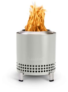 a white stove with flames coming out of it