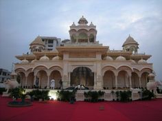 a large white building with arches and pillars