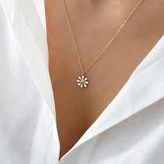 "Introducing the Tiny Daisy 14k Gold Necklace - the perfect blend of elegance and simplicity. This minimalist charm features a white enamel jewelry daisy, chamomile flower dainty pendant that is sure to turn heads. This necklace is perfect for bridesmaids or as a gift for her. The 14k gold material ensures that this necklace is of the highest quality and will last for years to come. The dainty and delicate design of this necklace makes it perfect for everyday wear or to dress up for a special oc Daisy Chamomile, Chamomile Flower, Dainty Pendant, Chamomile Flowers, 14k Gold Necklace, Necklace Minimalist, Delicate Design, Enamel Jewelry, White Enamel