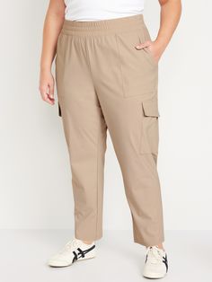 elastic waist front pockets flap-cargo pockets pull-on style go-dry wicks moisture four-way stretch breathable sits at belly button loose hip and thigh tapered leg 27" regular inseam 25" petite inseam 30" tall inseam models are approx.  5'9" and wear sizes s (4), l (12), and xl (18)machine wash according to the care instruction label Stretch Cargo Pants With Elastic Waistband For Workwear, Stretch Ankle-length Cargo Pants With Hip Pockets, Stretch Khaki Cargo Pants With Side Pockets, Comfort Stretch Pants With 5-inch Inseam And Pockets, Sporty Ankle-length Cargo Pants For Work, 4-way Stretch Athleisure Cargo Pants, Versatile 4-way Stretch Cargo Pants, Athleisure Cargo Pants For Workwear With Hip Pockets, Sporty Solid Cargo Pants For Workwear