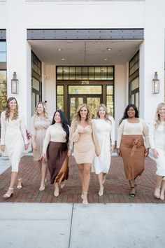 the bridesmaids are all dressed in white and brown