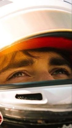 a close up of a person wearing a helmet