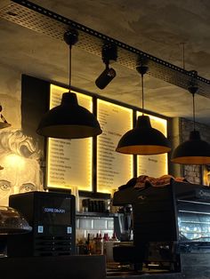 some lights hanging from the ceiling in a restaurant