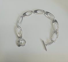 A beautiful Vintage Hallmarked Ferroni sterling silver bracelet. This brand of silver created a silver with less oxidisation to alleviate tarnish. Width 7 inches Please feel free to ask any questions. Bracelet Vintage, Sterling Silver Bracelet, Chain Link Bracelet, Sterling Silber, Link Bracelets, Sterling Silver Bracelets, Arm Band, Chain Link, Hallmark