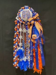 an orange, blue and white ribbon with the number 80 on it