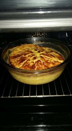 a pie is in the oven ready to go into the oven with it's door open